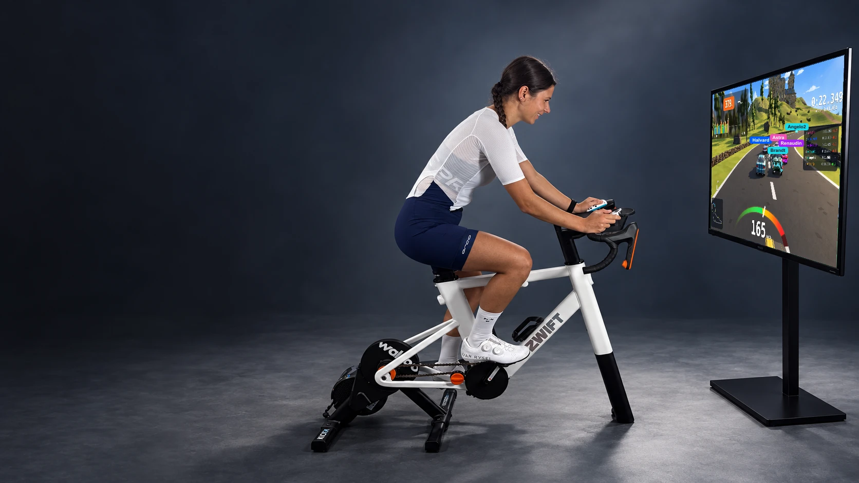A rider playing a game while cycling on an indoor trainer